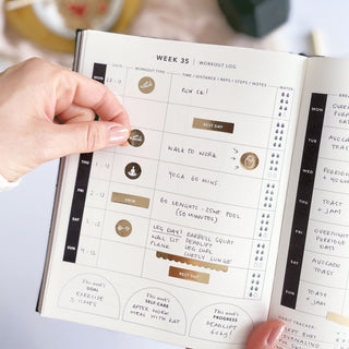 The Daily Fitness Planner covers 365 days of workout and meal planning. The fitness planner has an elegant vegan leather cover with 3 pages of gold stickers. 208 pages of fitness, meal planning, motivation and tracking. Hardback binding with foiled gilt edging to the pages. 165mm (W) x 210mm (H)