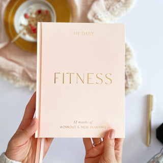 The Daily Fitness Planner covers 365 days of workout and meal planning. The fitness planner has an elegant vegan leather cover with 3 pages of gold stickers. 208 pages of fitness, meal planning, motivation and tracking. Hardback binding with foiled gilt edging to the pages. 165mm (W) x 210mm (H)