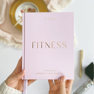 The Daily Fitness Planner covers 365 days of workout and meal planning. The fitness planner has an elegant vegan leather cover with 3 pages of gold stickers. 208 pages of fitness, meal planning, motivation and tracking. Hardback binding with foiled gilt edging to the pages. 165mm (W) x 210mm (H)