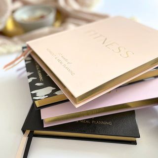 The Daily Fitness Planner covers 365 days of workout and meal planning. The fitness planner has an elegant vegan leather cover with 3 pages of gold stickers. 208 pages of fitness, meal planning, motivation and tracking. Hardback binding with foiled gilt edging to the pages. 165mm (W) x 210mm (H)