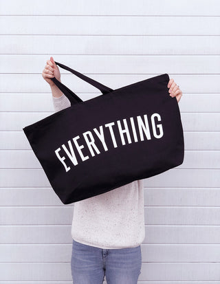 Really big bag with the word EVERYTHING in large white text across the body of the bag. The bag is made from 100% cotton tote and is available in a range of colours.