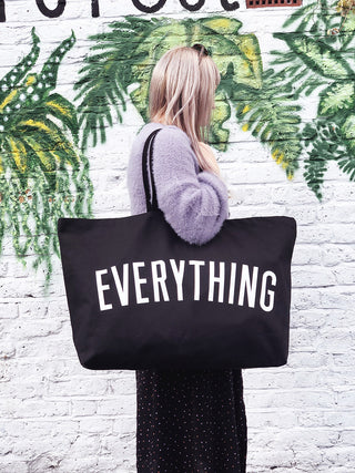 Really big bag with the word EVERYTHING in large white text across the body of the bag. The bag is made from 100% cotton tote and is available in a range of colours.