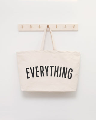 Really big bag with the word EVERYTHING in large black text across the body of the bag. The bag is made from 100% cotton tote and is available in a range of colours.