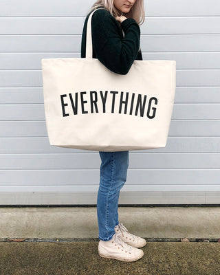 Really big bag with the word EVERYTHING in large black text across the body of the bag. The bag is made from 100% cotton tote and is available in a range of colours.