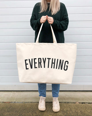 Really big bag with the word EVERYTHING in large black text across the body of the bag. The bag is made from 100% cotton tote and is available in a range of colours.