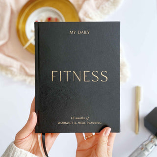The Daily Fitness Planner covers 365 days of workout and meal planning. The fitness planner has an elegant vegan leather cover with 3 pages of gold stickers. 208 pages of fitness, meal planning, motivation and tracking. Hardback binding with foiled gilt edging to the pages. 165mm (W) x 210mm (H)