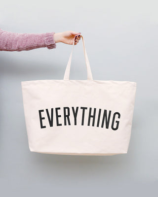 Really big bag with the word EVERYTHING in large black text across the body of the bag. The bag is made from 100% cotton tote and is available in a range of colours.