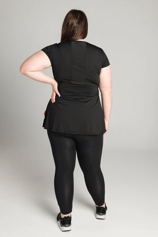 Image shows the back of Well Fit training top for plus size women. The back of the top has a sweat-wicking, perforated panel that allows for breathability. Well Fit tops and leggings are available in UK sizes 8 to 30. Free shipping over £100.