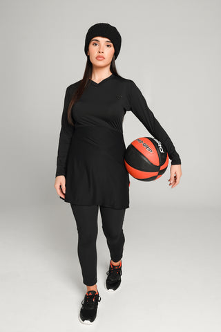 Well Fit Activewear. Female model wears black, lightweight, long sleeve, tunic-style gym top with black gym leggings. Well Fit tops and leggings are available in UK sizes 8 to 30. Free shipping over £100.