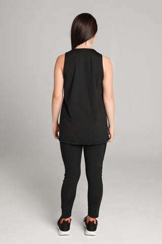 Well Fit Activewear. Female model wears long length, drop-arm gym vest and black compression leggings to the ankle. Well Fit tops and leggings are available in UK sizes 8 to 30. Free shipping over £100.